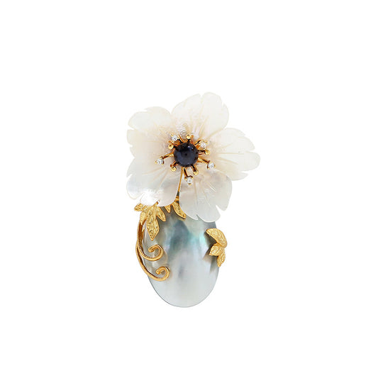 Natural mother-of-pearl brooch with golden stamens and diamonds